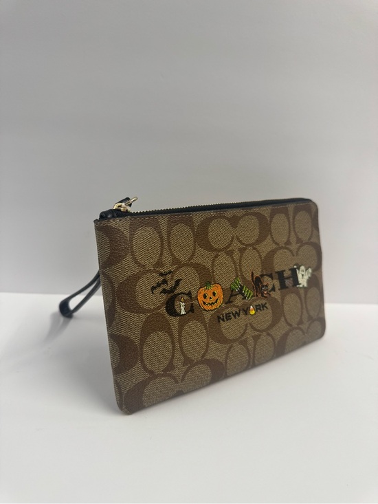 Coach Handbags - Coach Brown Signature Halloween Graphic Wristlet